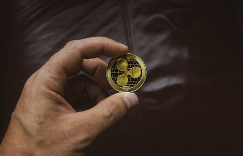 Ethereum (ETH) cryptocurrency logo on digital coins