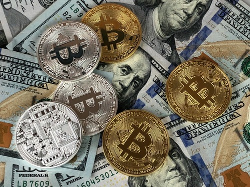 Bitcoin and Ethereum (ETH) cryptocurrency coins side by side