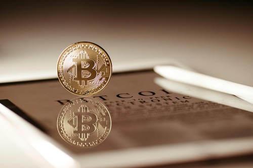 Person completing a cryptocurrency exchange on a smartphone