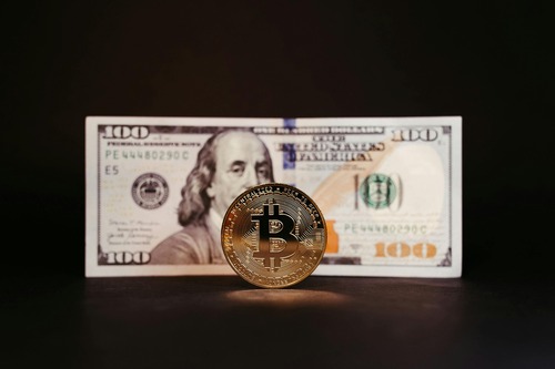 Person reviewing a USD Coin to Ethereum exchange on a laptop